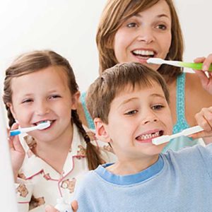 Family brushing the teeth